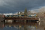 CSXT 465 Leads M426 over the Concord River Bridge